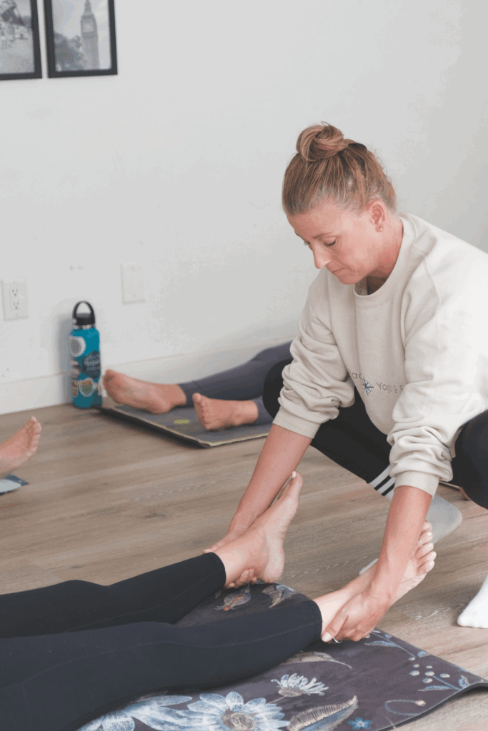 Pacific Yoga & Fitness, online yoga instructor, shares The Art of Adjustments: How to Offer Safe & Supportive Touch in Yoga Teaching.